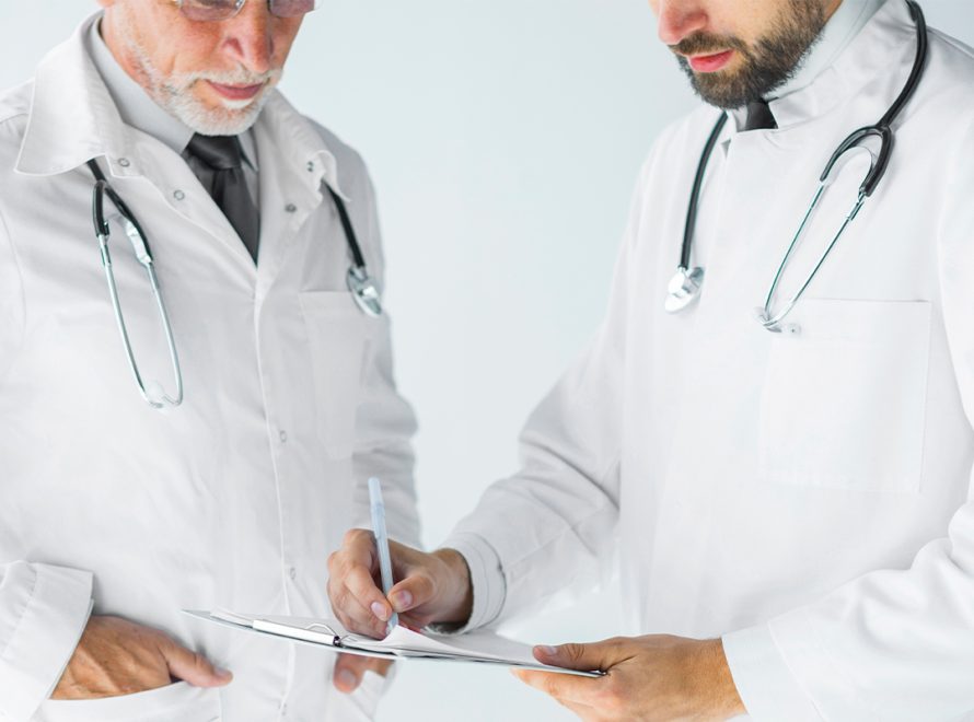 A physician conducts a clinical assessment of a patient suffering from erectile dysfunction as part of a specialized medical approach.